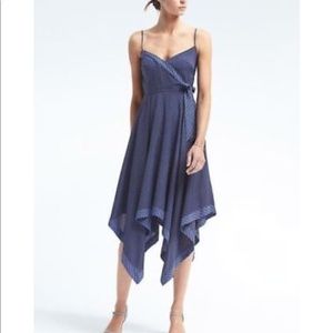 Sleeveless Faux Wrap Dress with Handkerchief Hem